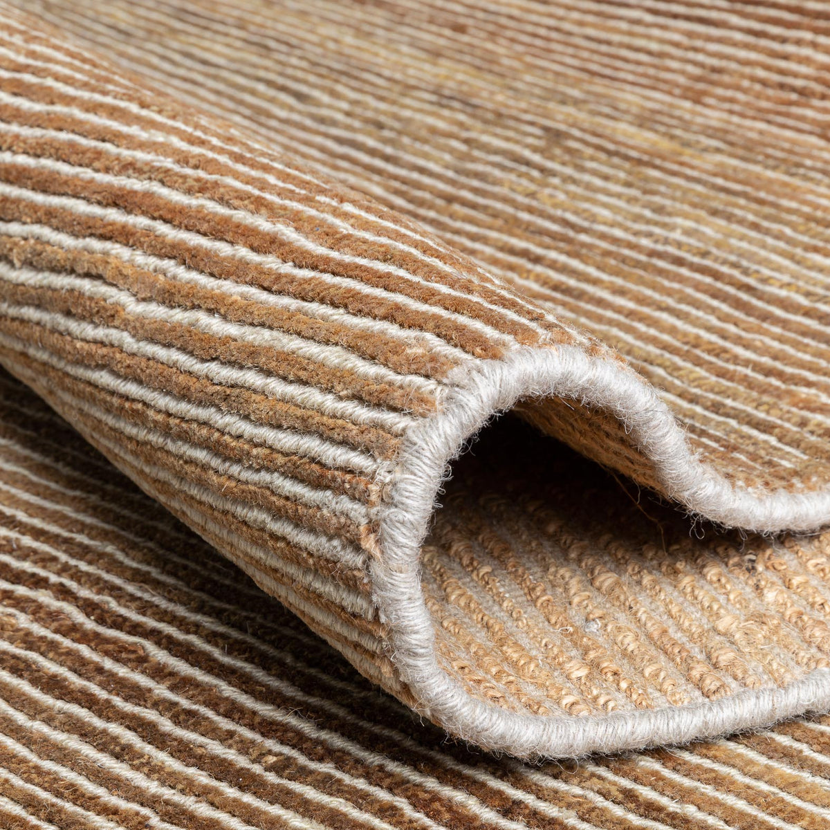 Dune Hand Knotted Rug by Ligne Pure, showing closeup view of dune hand knotted rug in live shot.