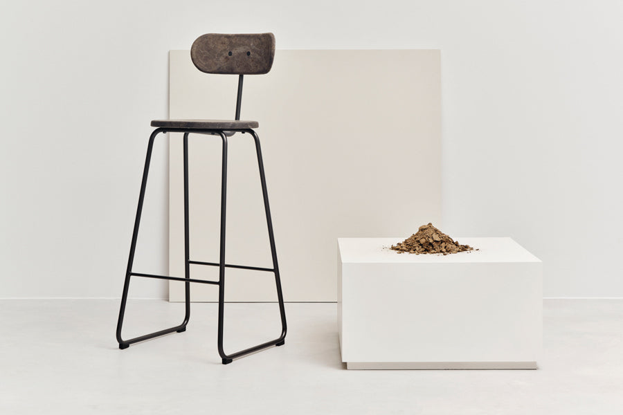 Earth Stool by Mater, showing earth stool in live shot.