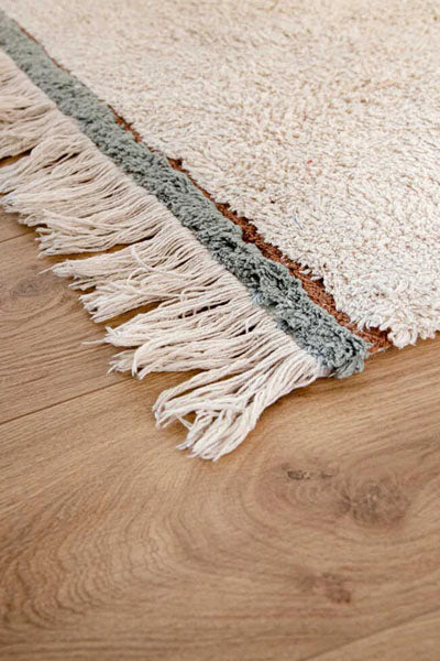 Eco-City Lanes Washable Rug by Lorena Canals, showing closeup view of eco-city lanes washable rug in live shot.
