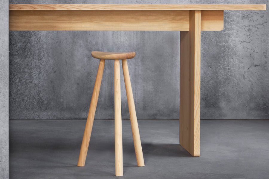 Edi Table by Nikari, showing closeup view of edi table with stool in live shot.