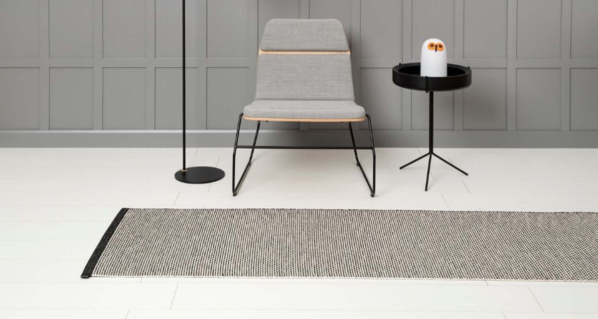Effi Black & Warm Grey with Vanilla Runner Rug by Pappelina, showing effi black & warm grey with vanilla runner rug in live shot.