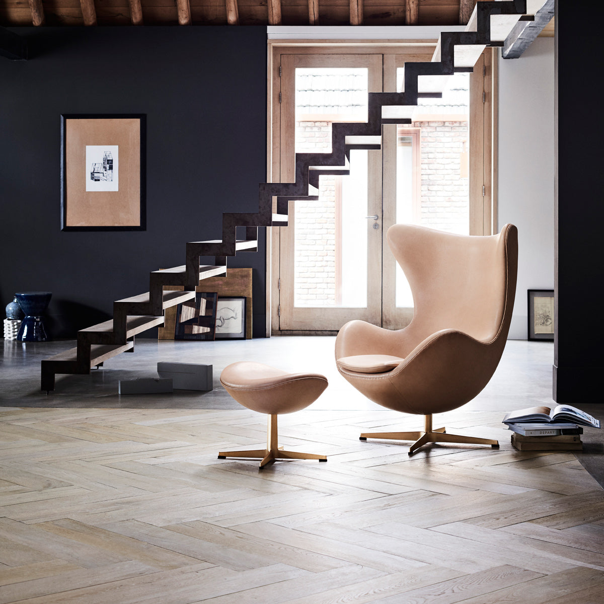 Egg Footstool by Fritz Hansen, showing egg footstool in live shot.