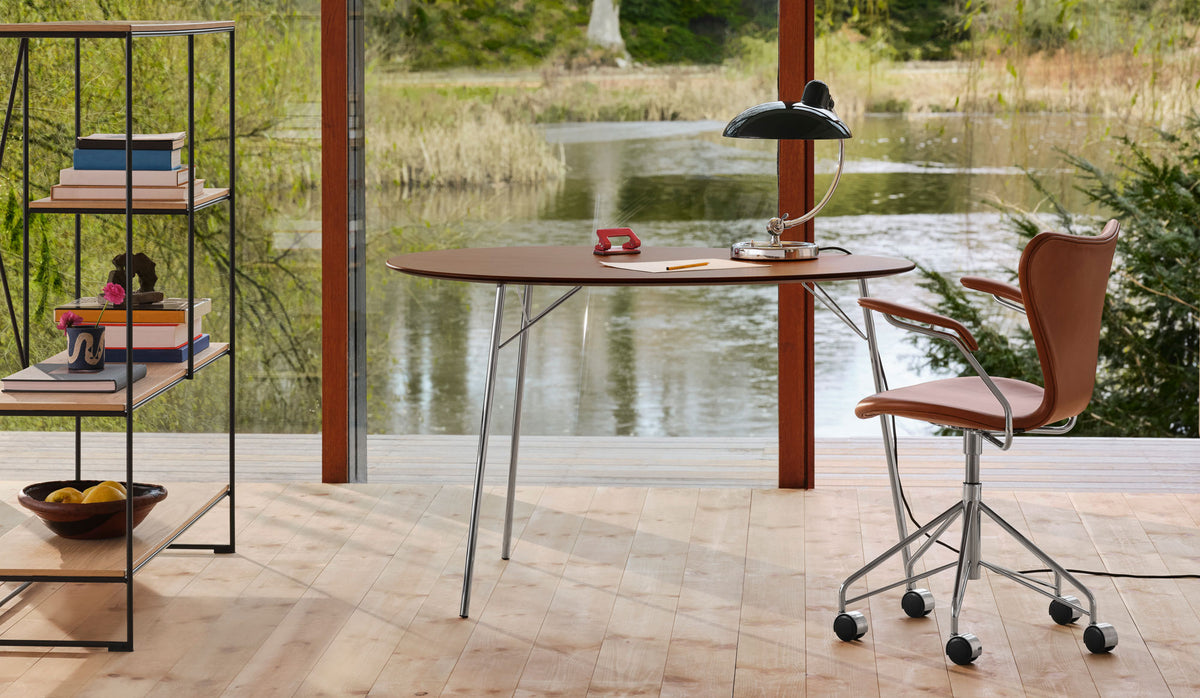 Egg Table by Fritz Hansen, showing egg table in live shot.