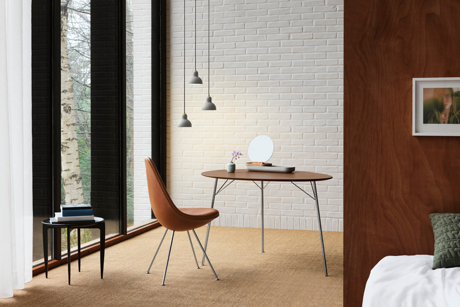 Egg Table by Fritz Hansen, showing egg table in live shot.