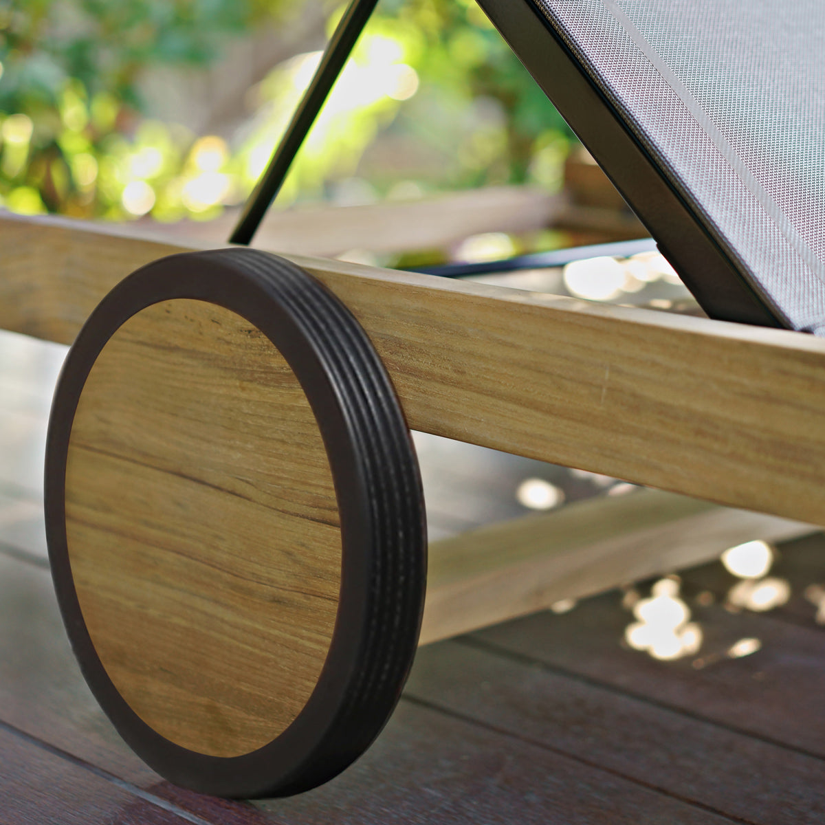 Ekka Double Lounger by Mamagreen, showing closeup view of wheels of ekka double lounger in live shot.