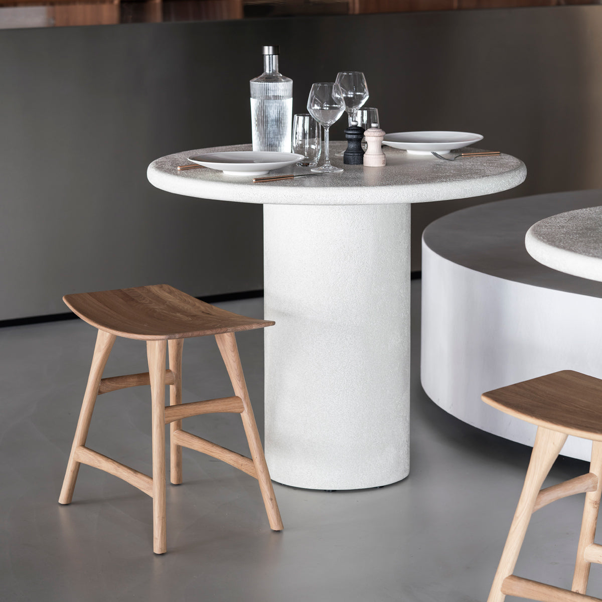 Elements Dining Table by Ethnicraft, showing elements dining table in live shot.