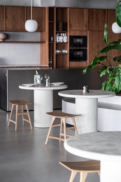 Elements Dining Table by Ethnicraft, showing elements dining tables in live shot.