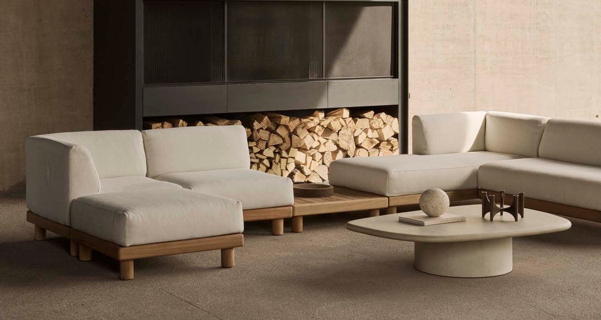 Elements Outdoor Coffee Table by Ethnicraft, showing angle view of elements outdoor coffee table in live shot.