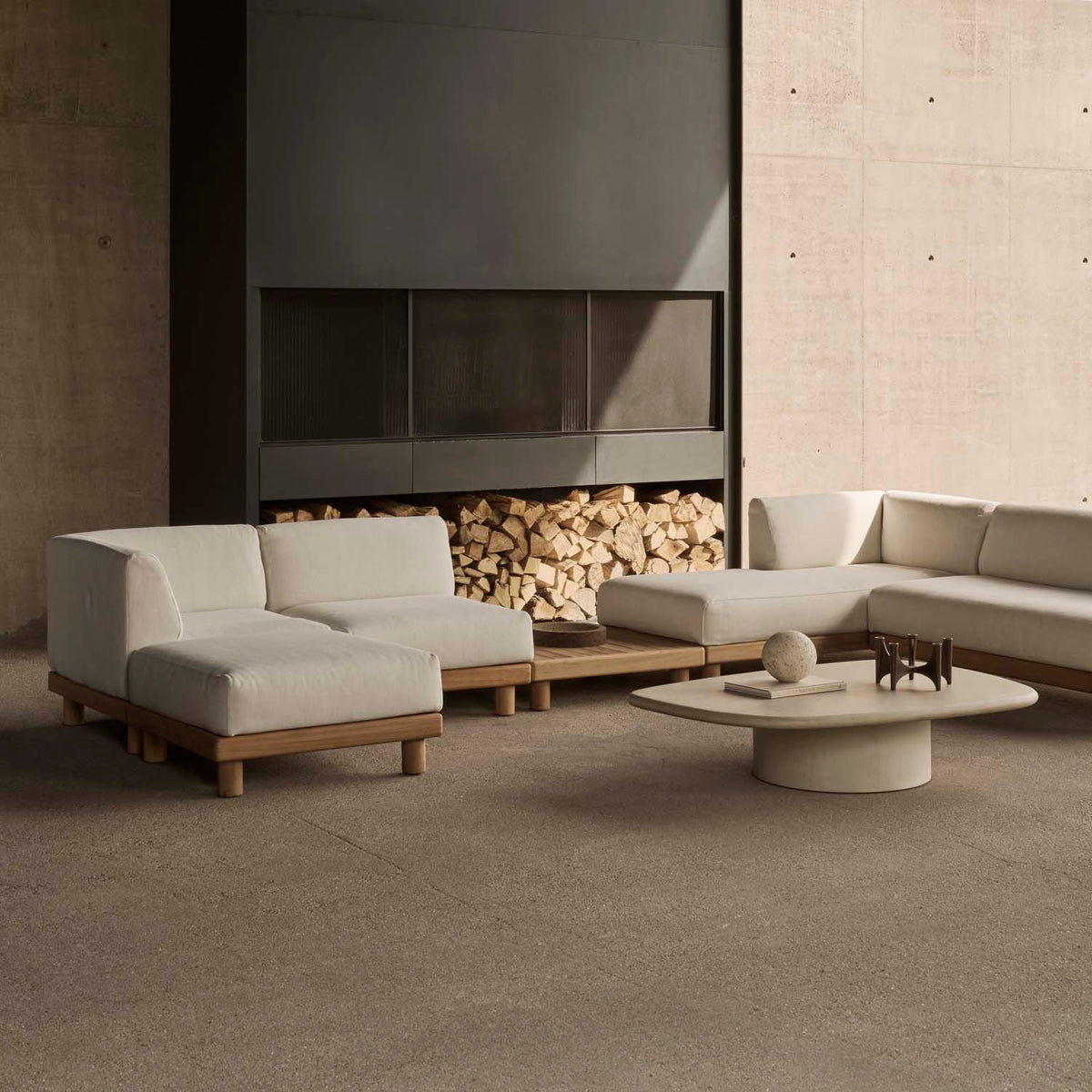 Elements Outdoor Coffee Table by Ethnicraft, showing angle view of elements outdoor coffee table in live shot.