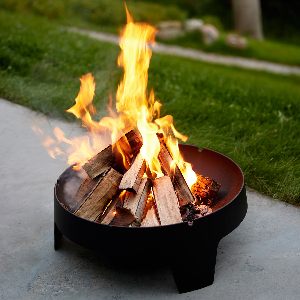 Ember Fire Pit by Cane-Line, showing ember fire pit in live shot.