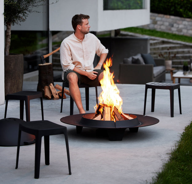 Ember Fire Pit by Cane-Line, showing ember fire pits in live shot.