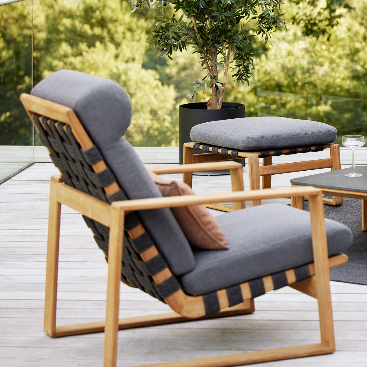 Endless Soft Footstool by Cane-Line, showing endless soft footstool in live shot.