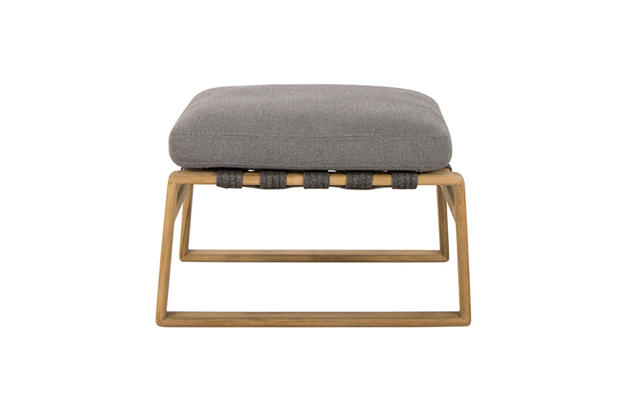 Endless Soft Footstool by Cane-Line, showing front view of endless soft footstool in dark grey soft rope/teak/grey airtouch cushion set.