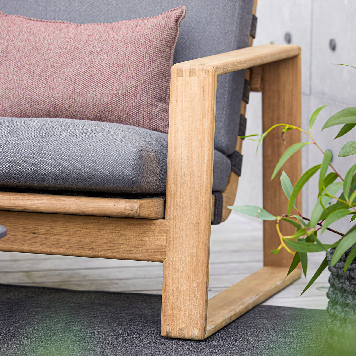 Endless Soft Highback Chair by Cane-Line, showing closeup view of endless soft highback chair in live shot.