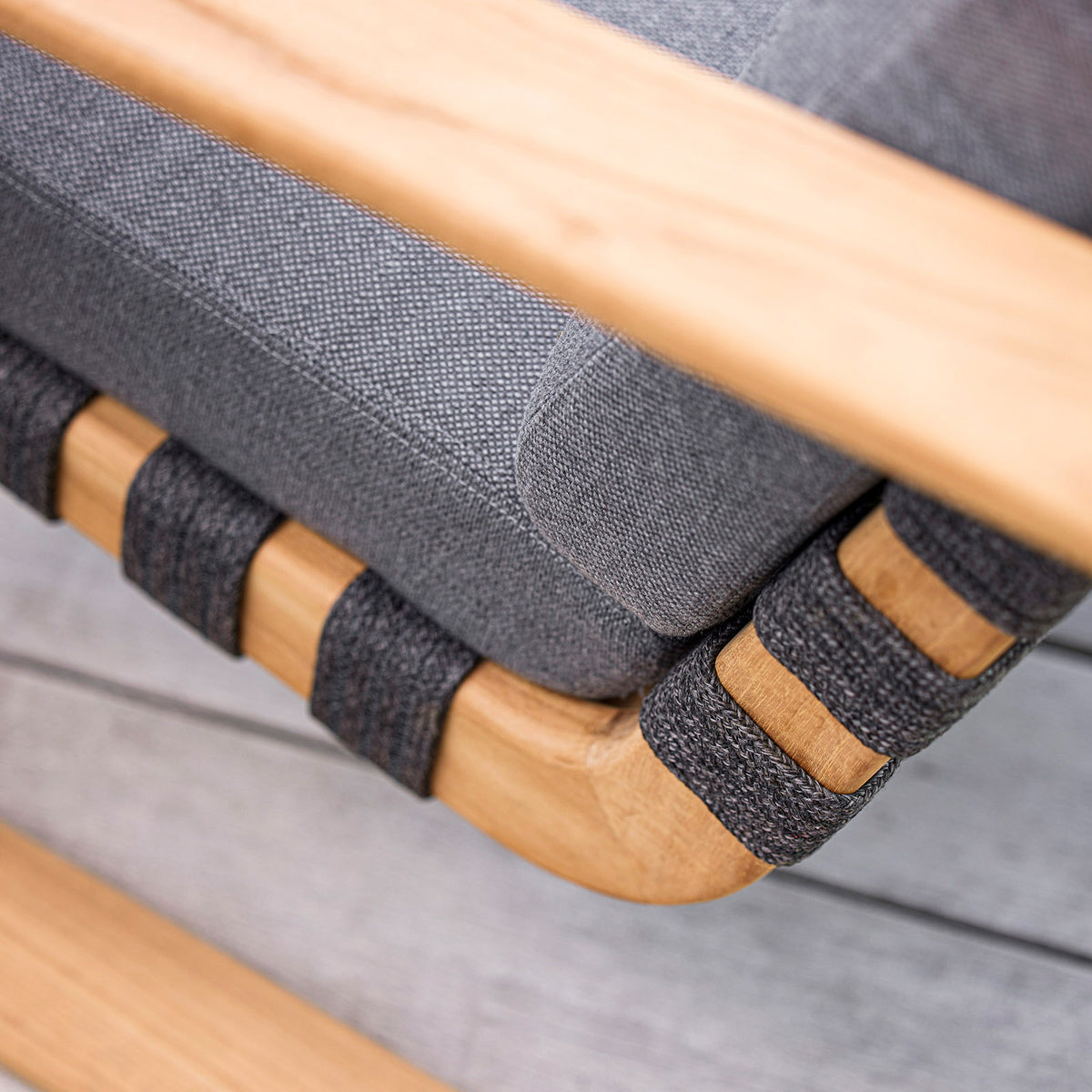 Endless Soft Highback Chair by Cane-Line, showing closeup view of endless soft highback chair in live shot.