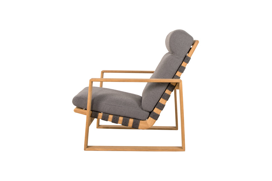 Endless Soft Highback Chair by Cane-Line, showing side view of endless soft highback chair in dark grey soft rope/teak/grey airtouch cushion set.
