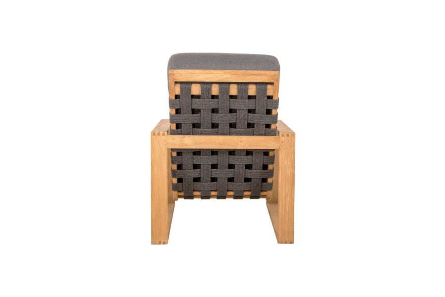 Endless Soft Highback Chair by Cane-Line, showing back view of endless soft highback chair in dark grey soft rope/teak/grey airtouch cushion set.