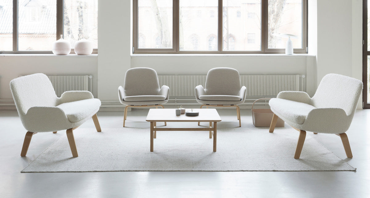 Era Lounge Chair by Normann Copenhagen, showing era lounge chairs in live shot.