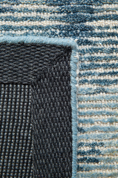 Erode Hand Tufted Rug by Ligne Pure, showing closeup view of erode hand tufted rug in live shot.