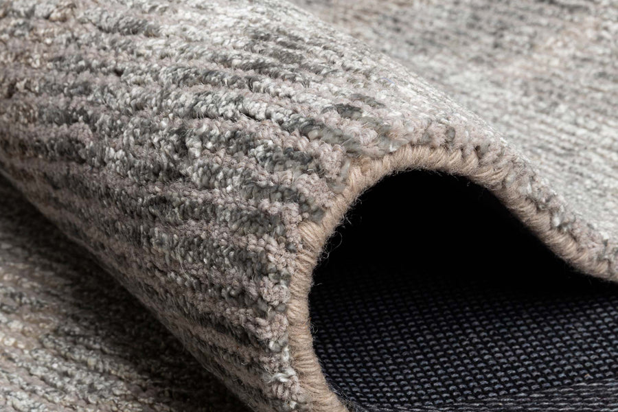 Erode Hand Tufted Rug by Ligne Pure, showing closeup view of erode hand tufted rug in live shot.