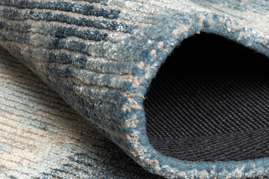 Erode Hand Tufted Rug by Ligne Pure, showing closeup view of erode hand tufted rug in live shot.