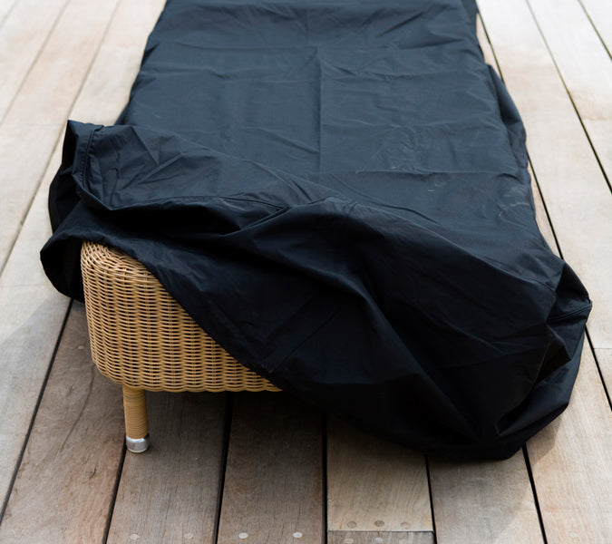 Escape Sunbed by Cane-Line, showing cover for escape sunbed in live shot.