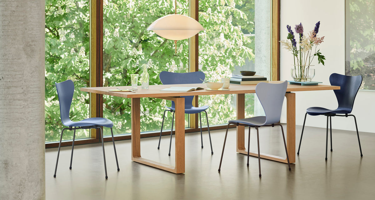 Essay Table by Fritz Hansen, showing essay table in live shot.