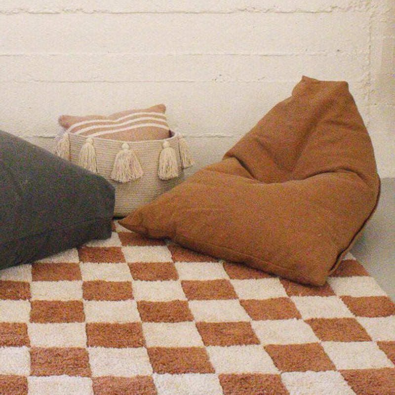 Exclusive Cleo Pouf by Lorena Canals, showing exclusive cleo pouf in live shot.