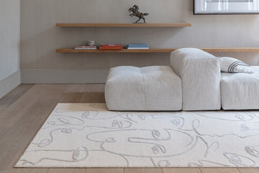 Faces Woven Rug by Ligne Pure, showing closeup view of faces woven rug in live shot.