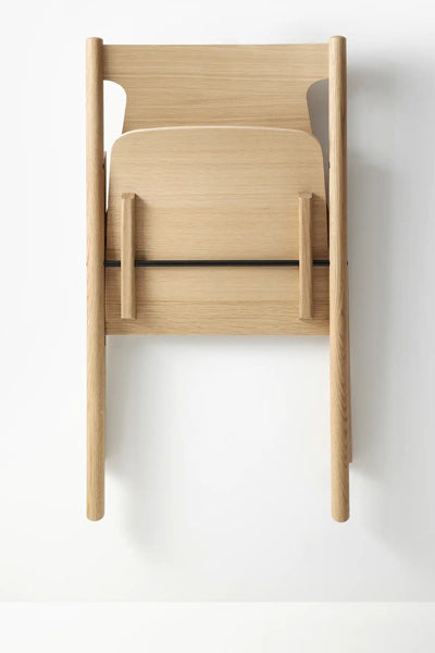 Faneeri Folding Chair by Nikari, showing fold view of faneeri folding chair.
