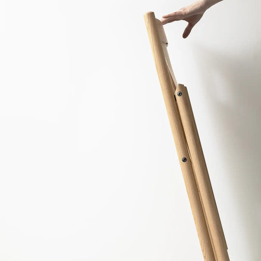Faneeri Folding Chair by Nikari, showing fold view of faneeri folding chair.