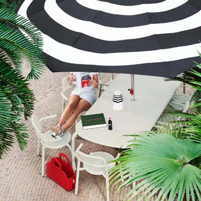 Toni Tablo Outdoor Dining Table by Fatboy, showing toni tablo outdoor dining table in live shot.