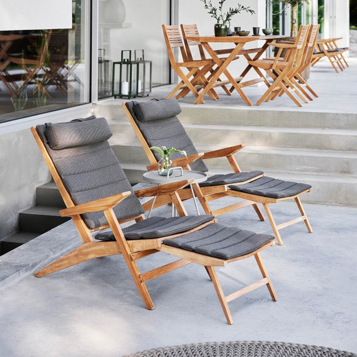 Flip Deck Chair by Cane-Line, showing flip deck chairs in live shot.