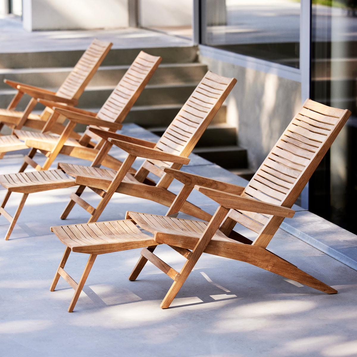 Flip Deck Chair by Cane-Line, showing flip deck chairs in live shot.