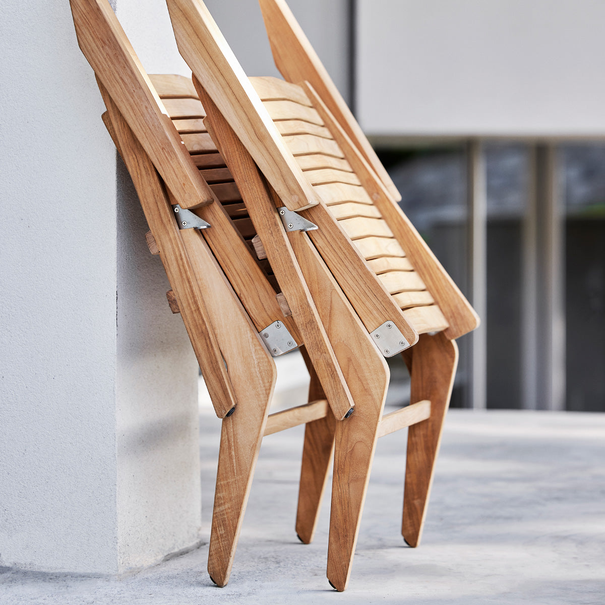 Flip Lounge Chair by Cane-Line, showing flip lounge chairs in live shot.