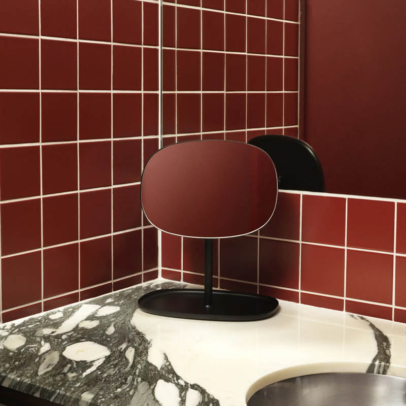Flip Mirror by Normann Copenhagen, showing flip mirror in live shot.