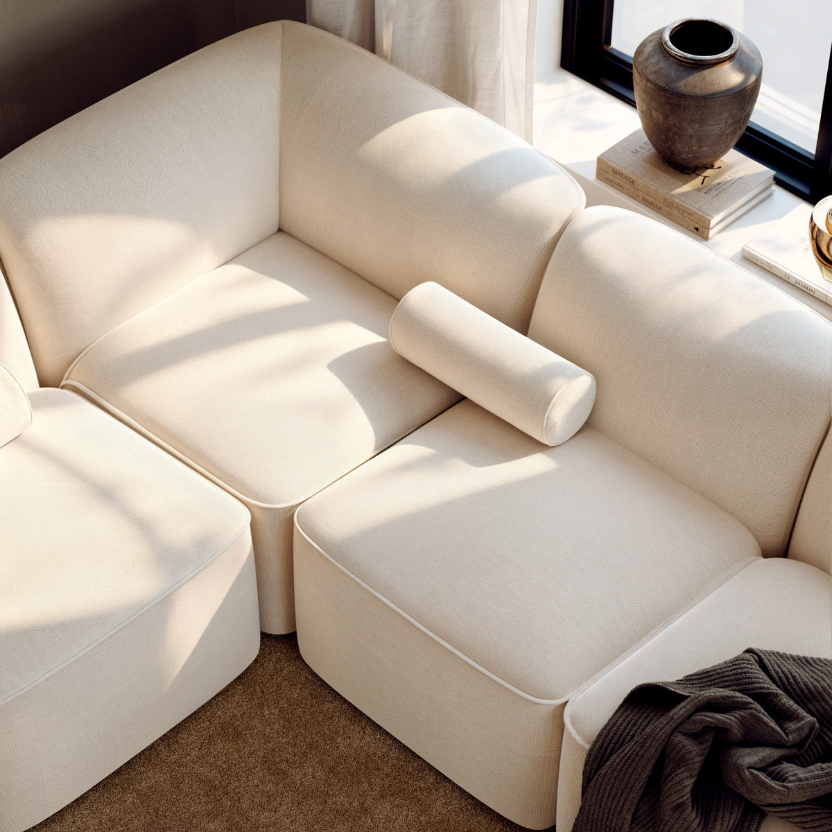 Flora Sofa by Woud, showing closeup view of flora sectional in live shot.