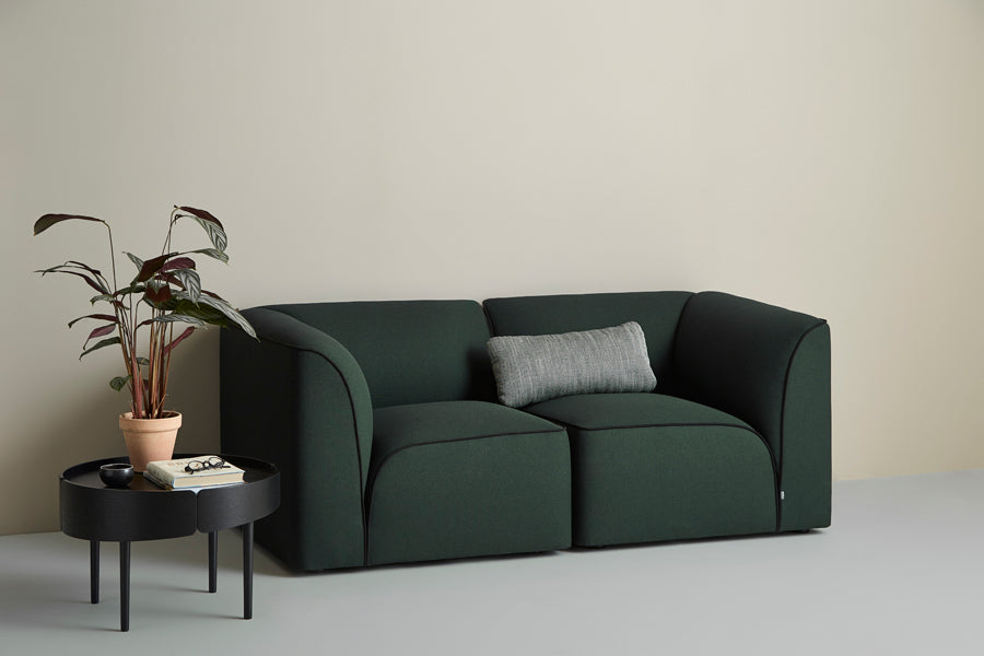 Flora Sofa by Woud, showing flora sofa in live shot.