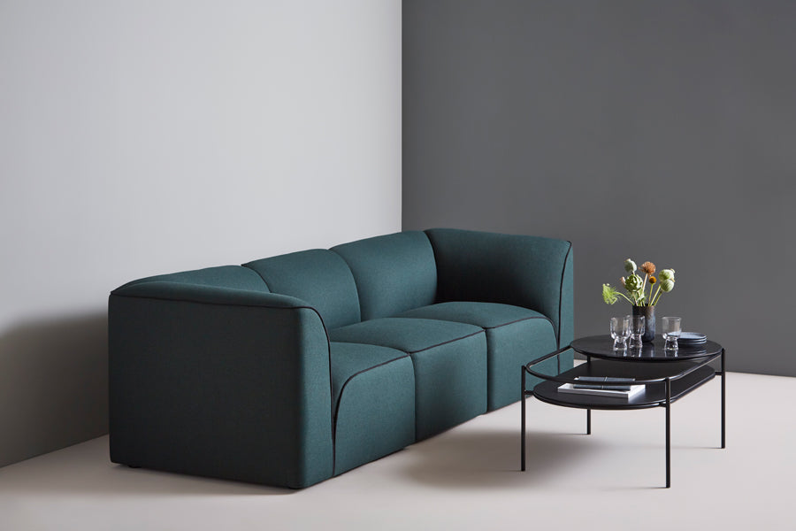 Flora Sofa by Woud, showing flora sofa in live shot.