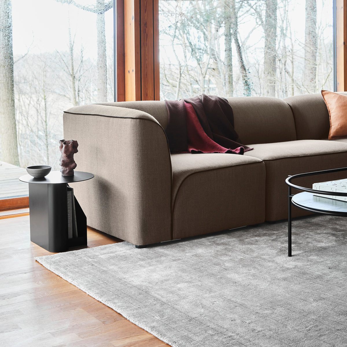 Flora Sofa by Woud, showing flora sofa in live shot.