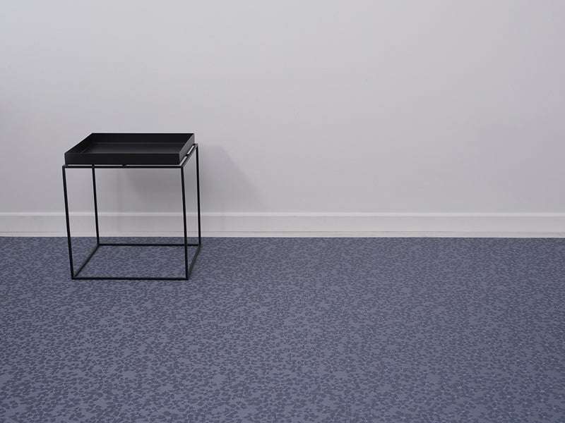 Flora Woven Floor Mat by Chilewich, showing closeup view of flora woven floor mat in live shot.