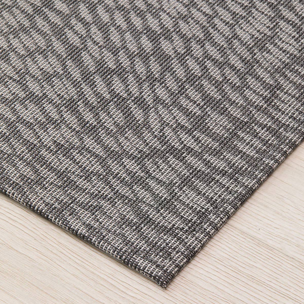 Flutter Woven Floor Rug by Chilewich, showing closeup view of flutter woven floor rug in live shot.