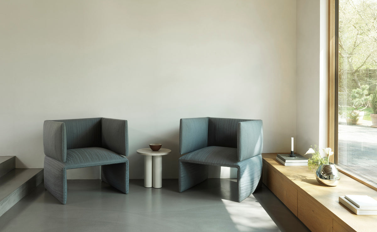 Fold Lounge Chair by Normann Copenhagen, showing fold lounge chairs in live shot.