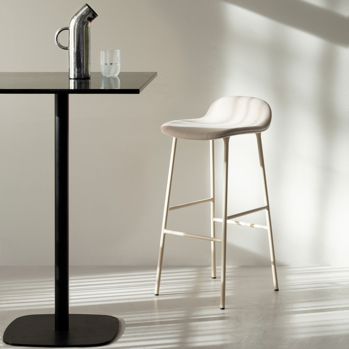 Form 30" High Full Upholstery Steel Barstool by Normann Copenhagen, showing form 30" high full upholstery steel barstool in live shot.