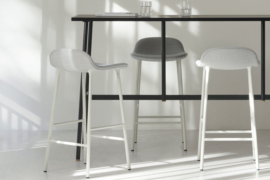 Form 30" High Full Upholstery Steel Barstool by Normann Copenhagen, showing form 30" high full upholstery steel barstools in live shot.
