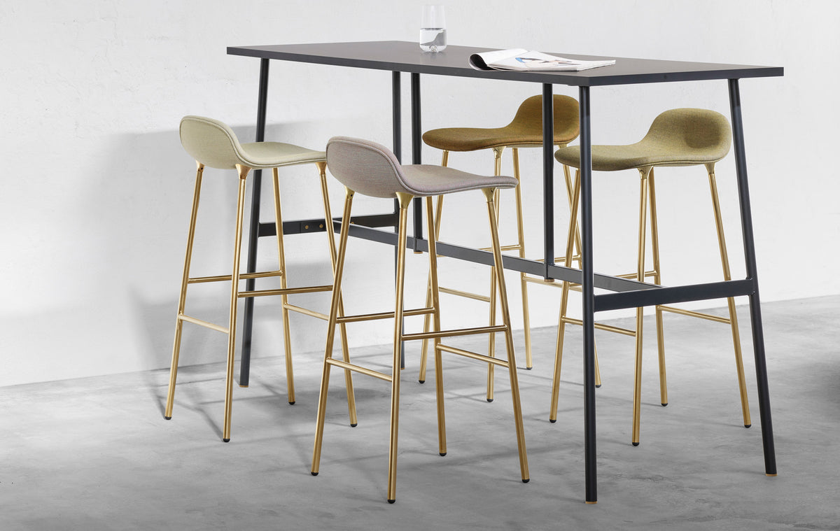 Form 34" High Full Upholstery Steel Barstool by Normann Copenhagen, showing form 34" high full upholstery steel barstools in live shot.