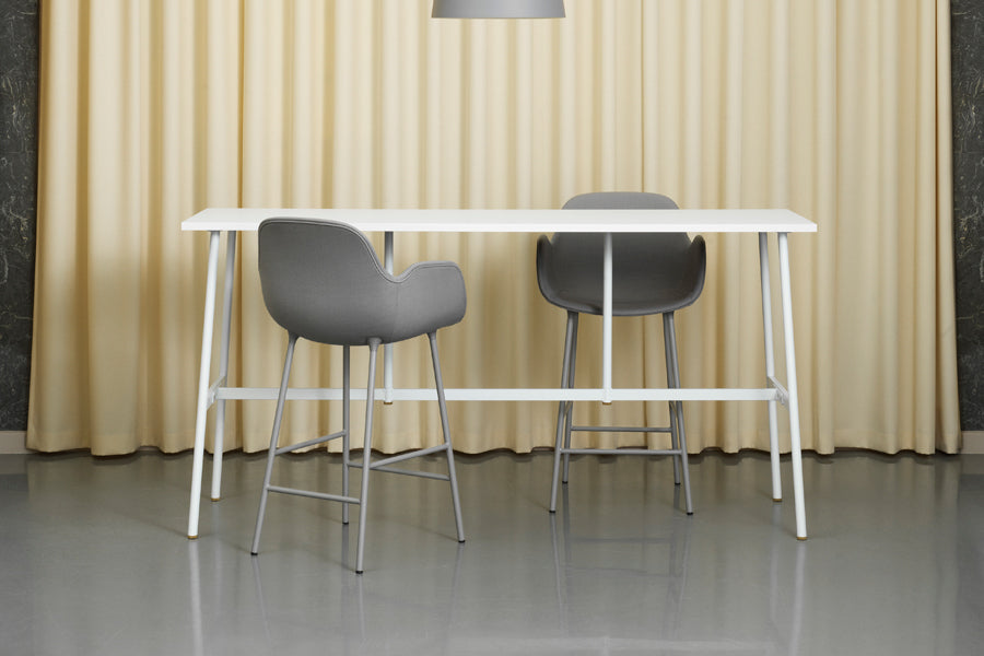 Form 39" High Bar Armchair by Normann Copenhagen, showing form 39" bar armchairs in live shot.