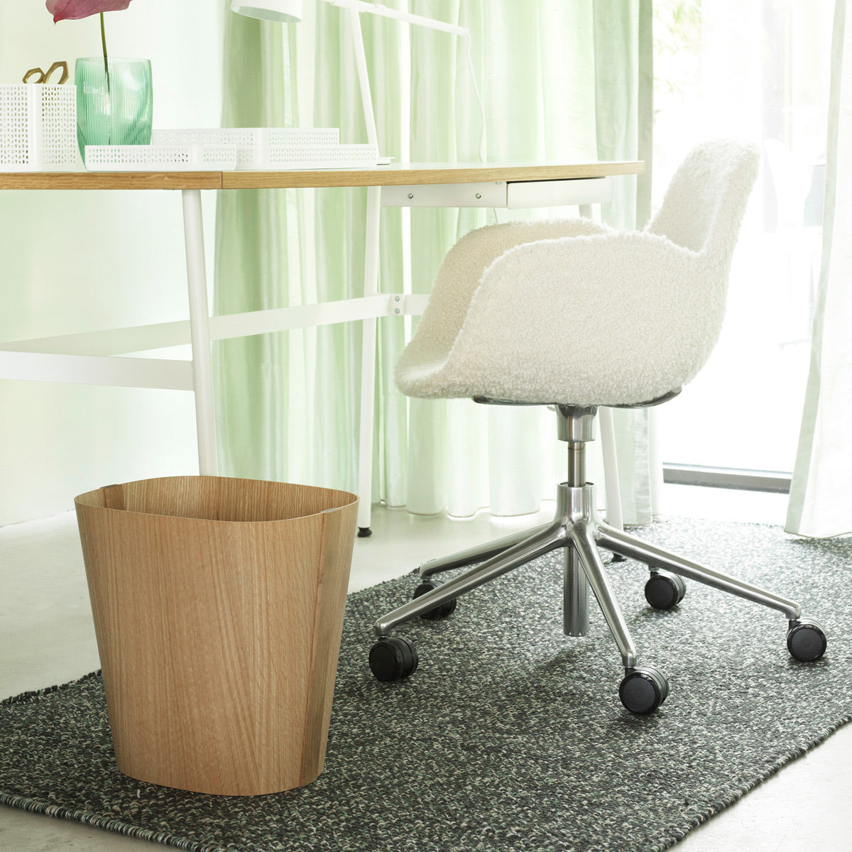 Form Swivel Gaslift Office Chair by Normann Copenhagen, showing form swivel gaslift office chair with table in live shot.