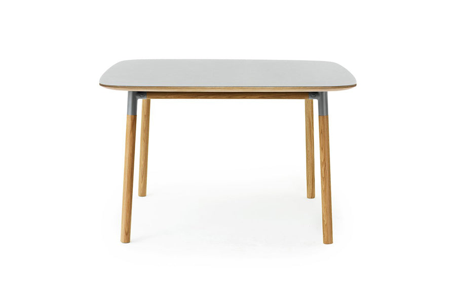 Form Table by Normann Copenhagen, showing front view of form table in square/grey linoleum.