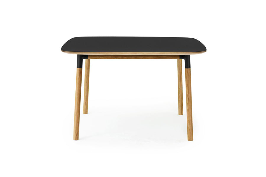Form Table by Normann Copenhagen, showing front view of form table in square/black linoleum.
